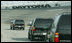 The motorcade of Vice President Dick Cheney takes a lap around the Daytona International Speedway in Daytona, Fla., Saturday, July 1, 2006, as the Vice President arrived to attend the 2006 Pepsi 400 NASCAR race.