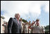 Troops from the Second Marine Expeditionary Force of United States Marine Corps. salute Vice President Dick Cheney as he takes the stage before delivering remarks at a rally at Camp Lejueune in Jacksonville, NC, Monday, October 3, 2005.