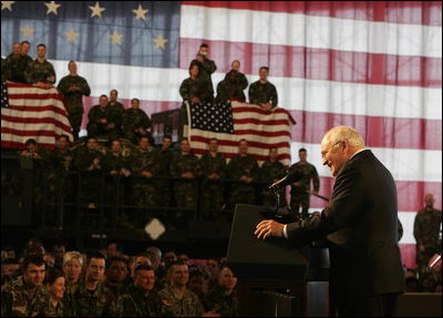 Vice President Dick Cheney participates in a rally with the troops at Scott Air Base, home of the US Transportation Command (USTRANSCOM), Tuesday, March 21, 2006. During the rally the vice president addressed the troops and thanked them for their efforts in the global war on terror. As the single manager of America's global defense transportation system, USTRANSCOM is tasked with the coordination of people and transportation assets that allows the US to project and sustain forces around the world.