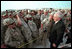 Troops at Al-Udeid Airbase in Qatar gather around Vice President Dick Cheney for pictures and handshakes March 17, 2002.