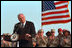 Discussing American initiatives in the war, Vice President Dick Cheney speaks to troops stationed at Al-Udeid Airbase in Qatar, March 17, 2002. "That is our first objective: To shut down terrorist camps wherever they are and to disrupt terrorist plans and to bring terrorists to justice," said the Vice President. "We'll make life very hard for them, by driving them from place to place until there is no place left to hide."