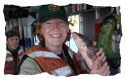 International Volunteer holding a fish