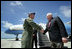 Vice President Dick Cheney is greeted by Brigadier General Doug Owens, Commander, 36th Wing, Thursday, Feb. 22, 2007, upon arrival to Andersen Air Force Base, Guam, for a rally with U.S. troops.