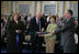 Mrs. Laura Bush is joined by U.S. Secretary of the Treasury Henry M. Paulson, Jr., left, and Richard C. Cote, curator, U.S. Department of the Treasury, as she cuts the ceremonial ribbon to mark the completion of the first major restoration at the U.S. Treasury Building, Thursday, Jan. 11, 2007, in Washington, D.C.