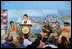 Mrs. Laura Bush is applauded by Hawaiian Gov. Linda Lingle, left, at the Northwest Hawaiian Islands Marine National Monument Naming Ceremony, Friday, March 2, 2007 in Honolulu, where Laura Bush unveiled the new Hawaiian name as the Papahanaumokuakea Marine National Monument. The Northwestern Monument represents the largest single conservation area in our nation's history and the largest protected marine area in the world. White House photo by Shealah Craighead 