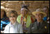 Mrs. Laura Bush and Mesa Verde National Park Superintendent Larry Wiese share a laugh, Thursday, May 23, 2006, during the celebration of the 100th anniversary of Mesa Verde and the Antiquities Act in Mesa Verde, Colorado. Also pictured are members of the Ute Mountain Ute Tribe. White House photo by Shealah Craighead 