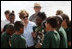 Mrs. Laura Bush visits with Florida City Elementary School students Wednesday, Feb. 6, 2008, during the Junior Ranger "First Bloom" planting event in Everglades National Park, Fla. President Bush on Monday asked Congress to spend $215 million for restoration of the Everglades.