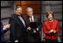 President George W. Bush, joined by Mrs. Laura Bush, is presented with the International Medal of PEACE by Pastor Rick Warren, Monday, Dec. 1, 2008, following their partipation at the Saddleback Civil Forum on Global Health in Washington, D.C.