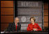 President George W. Bush and Mrs. Laura Bush react during a question and answer session Monday, Dec. 1, 2008, at the Saddleback Civil Forum on Global Health at the Newseum in Washington, D.C.