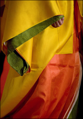 The hand of a model is barely seen under her layered sleeve during a demonstration Monday, July 7, 2008, of Junihitoe, 12-layered Ancient Kimono, for the G-8 spouses in Toyako, Japan. Junihitoe means 12 layers and is an example of the formal court dress worn by women during the Heian period (790-1185). Women were hidden behind screens at court and an occasional glimpse of their layered sleeves and hems was all that would be visible to a visitor or a suitor.