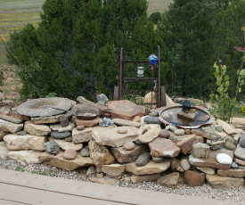 chipmunk and bird feeders, and a birdbath