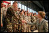 Mrs. Laura Bush shakes hands with military personnel Monday, Aug. 4, 2008, following remarks by President George W. Bush during their stop at Eielson Air Force Base, Alaska.