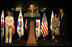 President George W. Bush and Mrs. Laura Bush receive a warm welcome during their arrival in Seoul on August 6, 2008. With the Bush's onstage at the United States Embassy is Ambassador Sandy Vershow, right, and Lisa Vershbow.