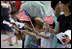 Children wave American and South Korean flags during the visit of President George W. Bush and Mrs. Laura Bush Wednesday, August 6, 2008, to Seoul. 