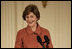 Mrs. Laura Bush speaks to the audience Monday, Jan. 28, 2008, during the President's Committee on the Arts and the Humanities Coming Up Taller awards ceremony in the East Room of the White House. Mrs. Bush told her audience, "The Coming Up Taller award winners have made a demonstrable impact on the lives of children, many of whom need extra attention from caring adults to help them stay on track for a healthy and successful life."