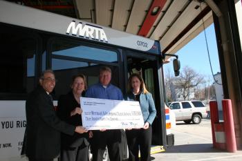 Tsongas presents a check for $392,000 to assist in the purchase of fourteen new buses for the Merrimack Valley Regional Transit Authority which will help meet the transportation needs of thousands of Merrimack Valley residents