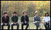 Mrs. Laura Bush is joined onstage by Boys and Girls Club student Jovanna Moreno age 11, right, and singer/songwriters the Jonas Brothers, Nick Jonas age 16, left, Joe Jonas age 19, 2nd from left, and Kevin Jonas age 20, 3rd left during a First Bloom event at the Trinity River Audubon Center, Sunday, November 2, 2008, in Dallas, TX.