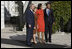 President George W. Bush and Mrs. Laura Bush welcome President-elect Barack Obama and Mrs. Michelle Obama to the White House Monday, Nov. 10, 2008, after the couple's South Portico arrival.