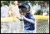 Stars player Bridget Donahue of Westborough, Mass., leaps for home plate during action in the Tee Ball on the South Lawn: A Salute to the Troops game Sunday, Sept. 7, 2008 at the White House, played by the children of active-duty military personnel.