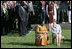 Mrs. Laura Bush and Ghana's first lady Theresa Kufuor sit together on the South Lawn of the White House during the South Lawn Arrival Ceremony Monday, Sept. 15, 2008, on the South Lawn of the White House.