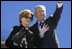 Mrs. Bush holds onto Miss Beazley Monday, March 28, 2005, as she and President George W. Bush wave goodbye upon boarding Air Force One in Waco, Texas, en route home to Washington D.C.