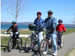 Dr. Joshua Meyerson, Emily's brother, rides the trail with his family on the Petoskey waterfront © Emily Meyerson
