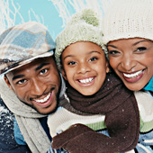 Photo of a young African-American couple and their son.