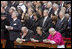 President George W. Bush and Laura Bush stand amidst mourners at funeral services Friday, April 8, 2005, for the late Pope John Paul II in St. Peter's Square. The funeral is being called the largest of its kind in modern history.