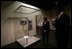 Mrs. Laura Bush looks at a dress worn by Jacqueline Kennedy during a tour of the exhibit First Ladies: Political Role and Public Image at the National Constitution Center Monday, Oct. 1, 2007, in Philadelphia.