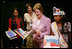 Mrs. Laura Bush looks over reading materials on display Friday, Aug. 3, 2007, at the various information and educational booths of the Saint Paul Community Partnerships Serving American Indian Youth at the Helping America's Youth Fourth Regional Conference in St. Paul, Minn. White House photo by Chris Greenberg