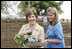 Mrs. Laura Bush and Ms. Jenna Bush pick vegetables during their visit to the Fann Hospital garden with Senegalese First Lady Viviane Wade and her daughter Tuesday, June 26, 2007, in Dakar, Senegal. Supported by USAID, the Fann Hospital gardens provide fresh vegetables to address the nutritional needs of patients with HIV/AIDS, an overlooked, but essential part of their care. 