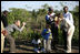 Mrs. Laura Bush and a young boy pose for Ms. Jenna Bush during their visit at a malaria-spraying site Wednesday, June 27, 2007, in Mozal, Mozambique.