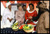 Mrs. Laura Bush listens to a briefing about the Millennium Challenge Corporation with First Lady Mrs. Toure Lobbo Traore and her daughter, Mrs. Bah Mabo Toure, Friday, June 29, 2007, in Bamako, Mali.