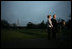 President George W. Bush, accompanied by Mrs. Laura Bush, talks to reporters before their departure to Ukraine Monday, March 31, 2008, on the South Lawn of the White House. President Bush urges Congress to pass the FISA reform bill and to act quickly to approve the Colombian Free Trade Agreement. President and Mrs. Laura Bush depart on a six-day trip to Ukraine, Romania, Croatia, and Russia. President Bush will have a scheduled meeting with Russian President Vladimir Putin.