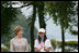 Mrs. Laura Bush stands with Natsumi Kagawa, age 11, after planting a tree at the Toyako New Mount Showa Memorial Park Wednesday, July 8, 2008, during the ceremony in Hokkaido, Japan. The wives of each of the G8 Summit leaders planted a small evergreen tree along a park walkway.