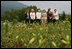 With Mt. Yoteizan as a backdrop, Mrs. Laura Bush and the G8 spouses pause Tuesday, July 8, 2008, for a photo in the village of Makkari, known for its lilies and potatoes, on the northern Japanese island of Hokkaido. From left are Mrs. Margarida Uva Barosso, wife of the President of European Commission; Mrs. Laureen Harper, wife of the Prime Minister of Canada; Mrs. Kiyoko Fukuda, wife of the Prime Minister of Japan; Mrs. Laura Bush; Mrs. Sarah Brown, wife of the Prime Minister of the United Kingdom; and Mrs. Svetlana Medvedeva, wife of the President of Russia.