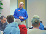 Click to enlarge - Shawn Shouse, Extension Agricultural Engineer, discusses land application separation distances at a dry poultry manure applicator certification meeting in Greenfield.  Photo: R. Klein