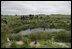 Mrs. Laura Bush tours Eastern Island Monument Seep wetlands Thursday, March 1, 2007, where several endangered Laysan ducks were brought it in 2004. A freshwater pond was dug and native grasses were restored to create breeding grounds for the ducks.