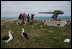 Mrs. Laura Bush views albatross birds and remnants of World War II with wildlife biologist John Klavitter during a tour of Eastern Island on Midway Atoll, part of the Northwest Hawaiian Islands National Monument, Thursday, March 1, 2007. Midway Atoll was the site of the Battle of Midway June 4, 1942. The U.S. Navy defeated a Japanese attack against Midway Islands, marking a turning point in the war in the pacific theater.