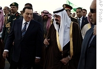 King Abdullah of Saudi Arabia, right, talks with Egyptian President Hosni Mubarak, left, after his arrival in Riyadh, Saudi Arabia, Tuesday, 13 Jan. 2009