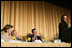 President George W. Bush, Laura Bush and Sen. Mark Pryor (D-Ark.) break out in laughter as Bono speaks during the National Prayer Breakfast Thursday morning at the Hilton Washington Hotel.