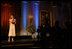 President George W. Bush and Laura Bush listen to country music artist LeAnn Rimes perform in the East Room of the White House during a dinner honoring The Dance Theatre of Harlem Monday, February 6, 2006.