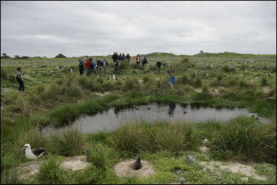 Mrs. Laura Bush tours Eastern Island Monument Seep wetlands Thursday, March 1, 2007, where several endangered Laysan ducks were brought it in 2004. A freshwater pond was dug and native grasses were restored to create breeding grounds for the ducks.