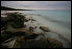 The sun sets over Rusty bucket beach after Mrs. Laura Bush's tour of Sand and Eastern Islands in Midway Atoll Thursday, March 1, 2007. President Bush designated the islands as a national monument June 15, 2006. It is the single largest conservation area created in U.S. history and the largest protected marine area in the world. 