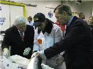 Secretary Leavitt and Commissioner Dr. von Eschenbach inspecting salmon
