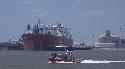 Photograph of: Coast Guard patrol boat passes in front of first LNG Ship to arrive in Freeport (2)