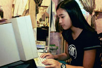Photo of a girl using her computer