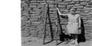 Girl with ancestral Puebloan ladder - 1910s