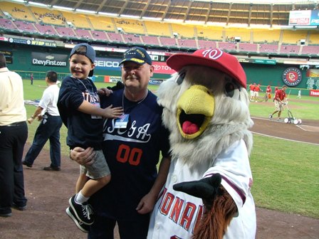 Photo of Admiral Thad Allen with his grandson and the Washington Nationals Mascot