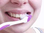 Photo of girl brushing her teeth